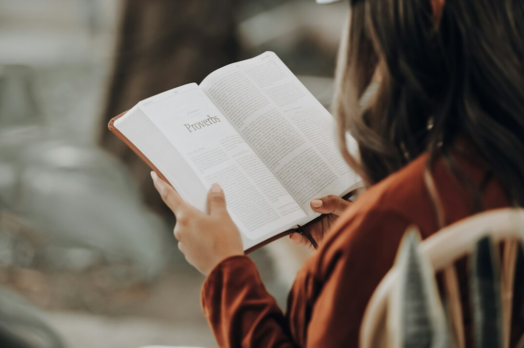 woman reading educational book